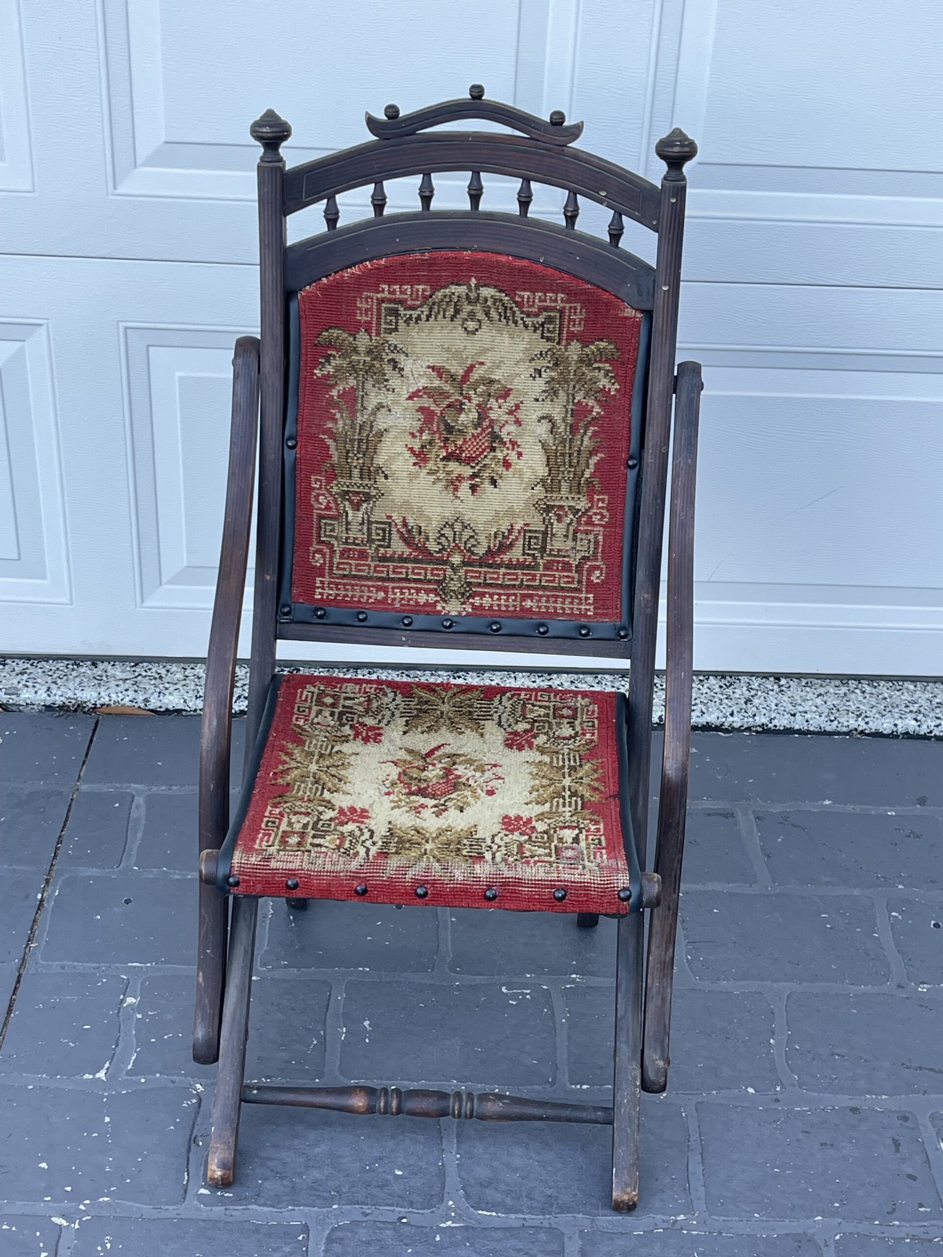 Antique chair with ornate upholstery