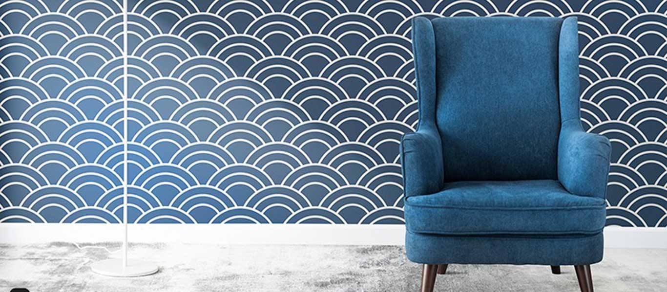 Blue chair against wave-patterned wall
