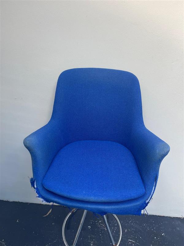 Blue chair with frayed edges