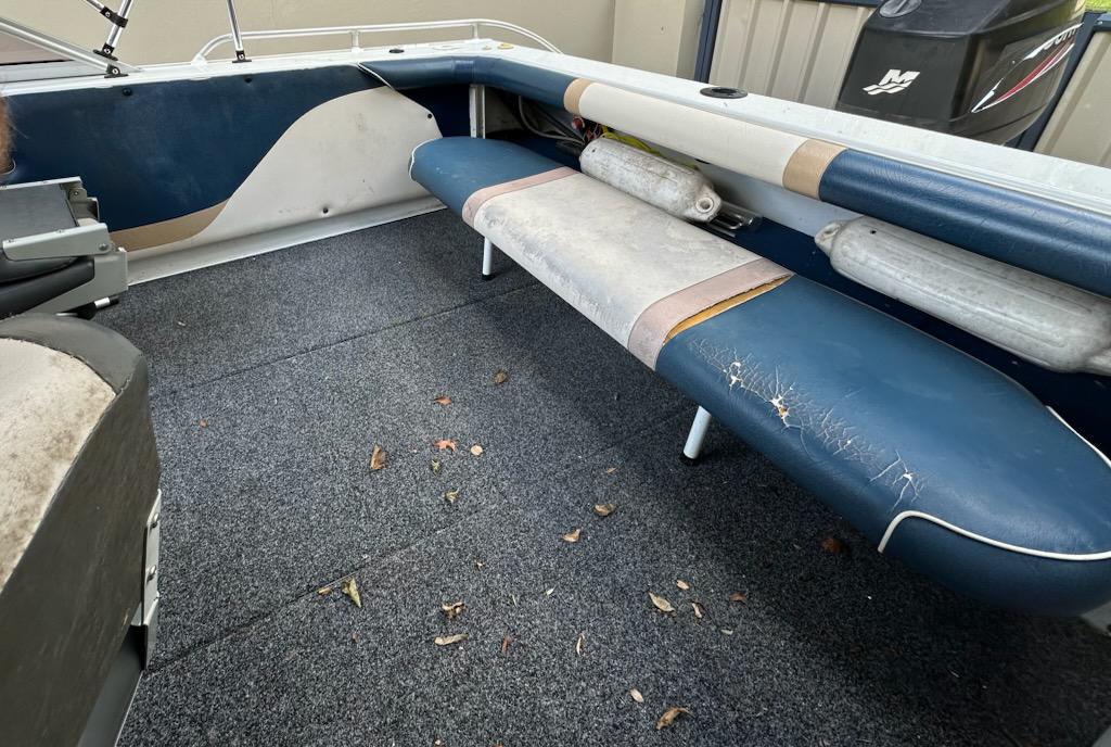 Boat interior with worn seating area