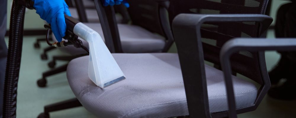 Cleaning an office chair with vacuum