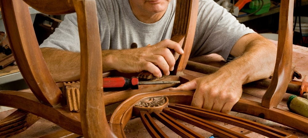 Craftsman repairing wooden furniture