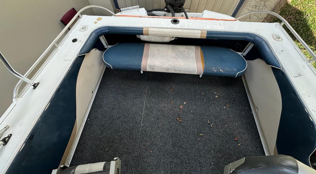 Empty boat interior with carpeted floor