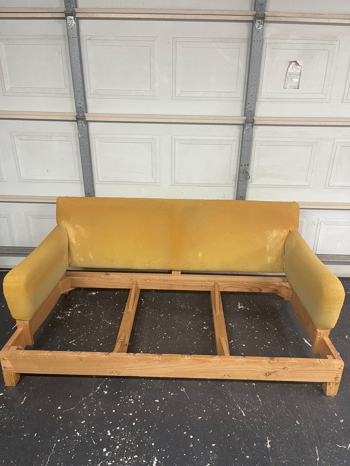 incomplete wooden couch frame