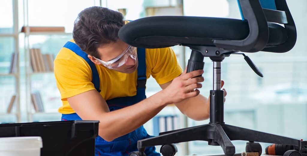 Man repairing an office chair