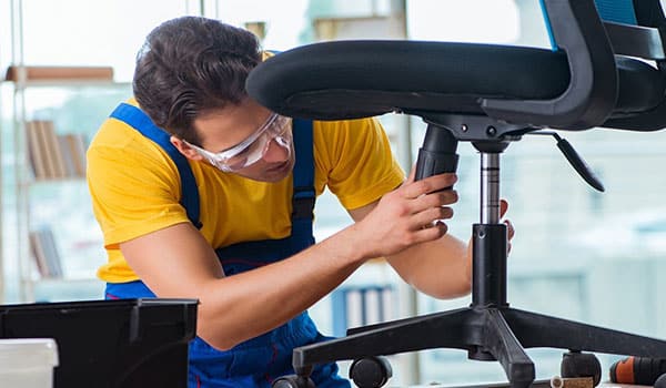 Man repairing an office chair
