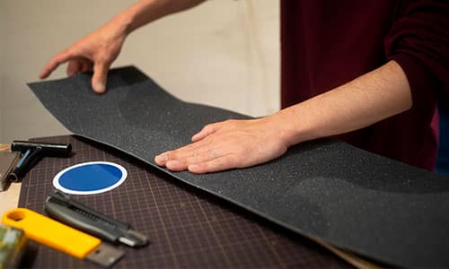 Person working with black material