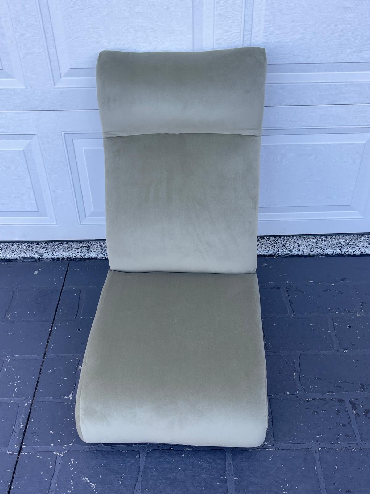 Simple green lounge chair on floor