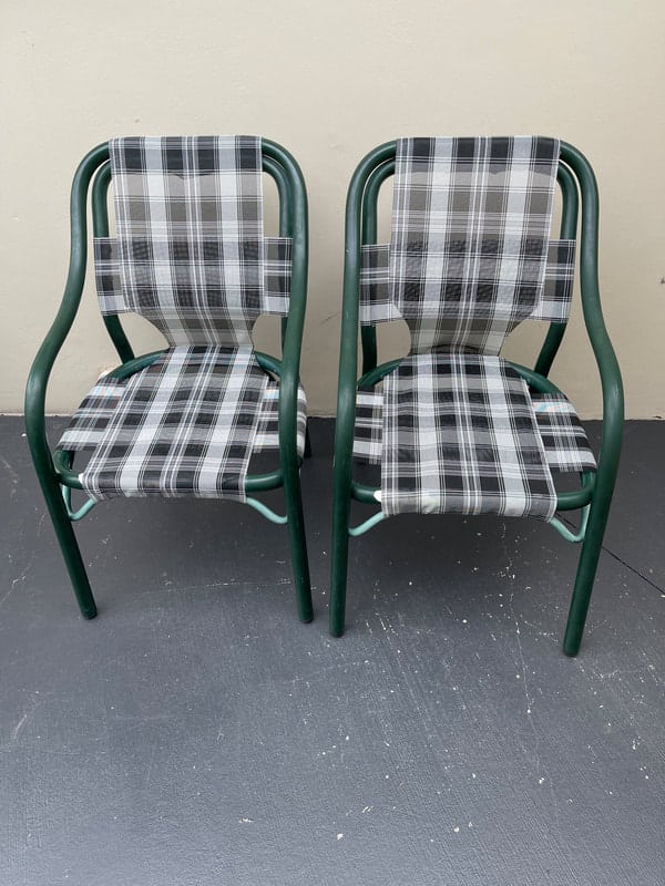 Two plaid-patterned chairs on floor
