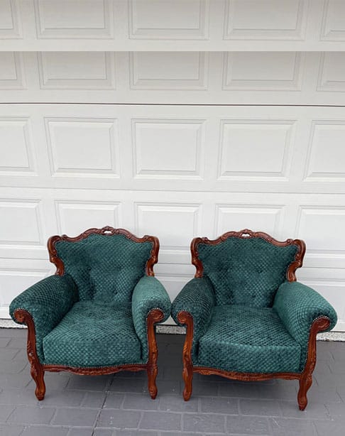 Two vintage green armchairs side by side