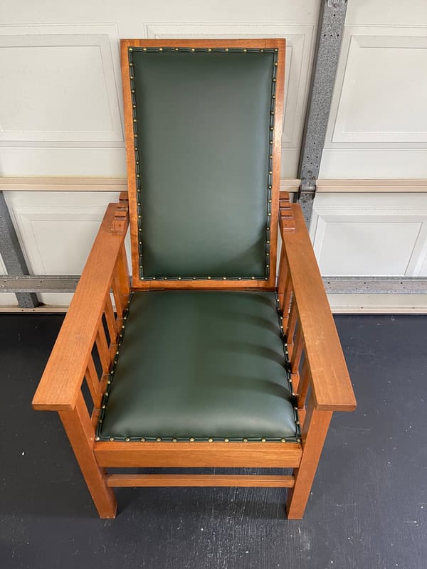 Wooden chair with green upholstery