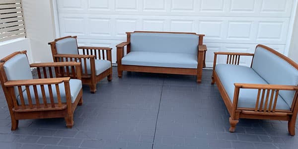 Wooden furniture set with blue cushions