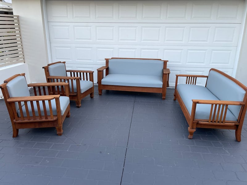 Wooden furniture set with blue cushions
