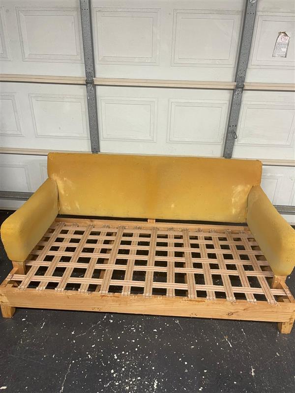 Yellow couch with wooden frame